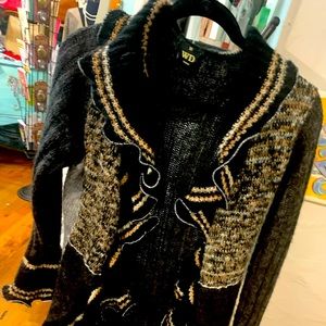 One-of-a-kind ruffled cardigan.